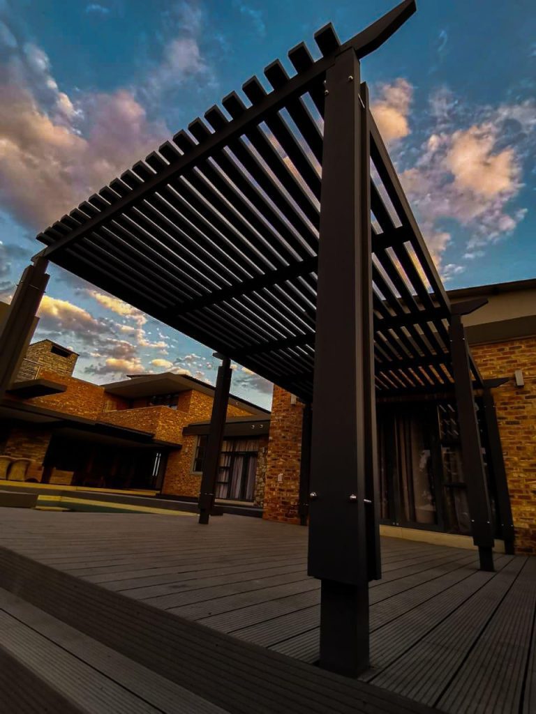 Premium composite pergola installed over a modern outdoor entertainment area in South Africa