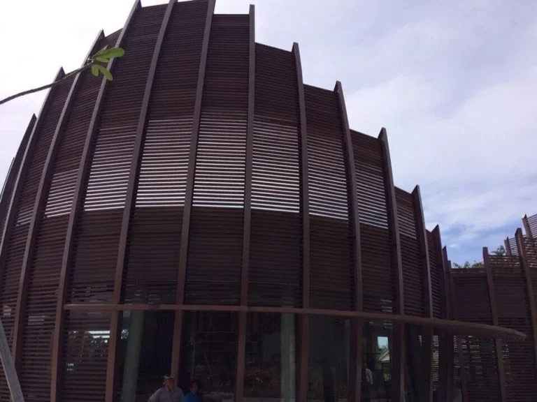 Architectural composite cladding installed on a modern commercial building with vertical façade screening in South Africa.